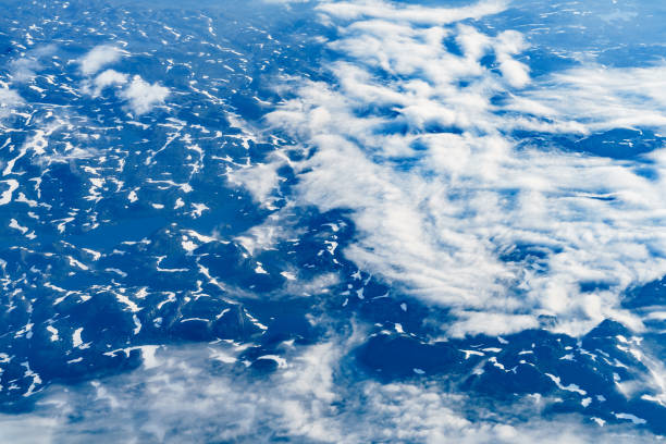 istock View from airplane to clouds and land 1745191324