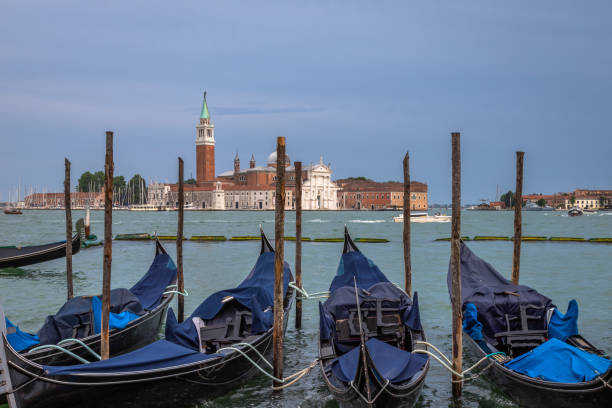 istock Gongolas and Abbazia in Venice 1745233955