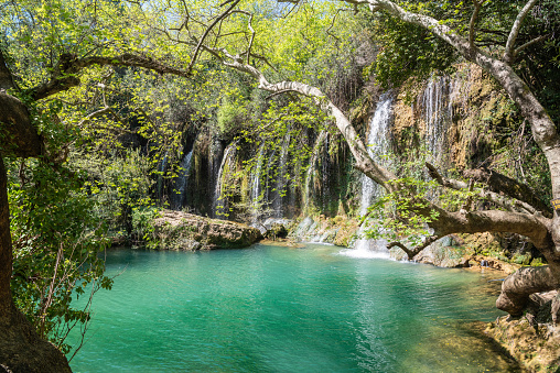 Kursunlu waterfall in Antalya, Turkey. The waterfall is on one of the tributaries of the Aksu River, where the tributary drops from Antalya's plateau to the coastal plain. It is situated in the midst of a pine forest.