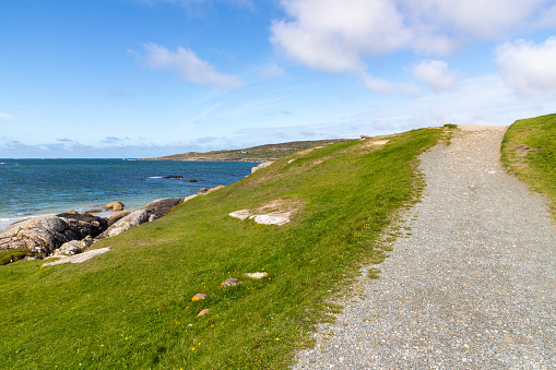 Trail in the beach with grass on dogs bay, Roundstone, Conemara, Galway, Ireland