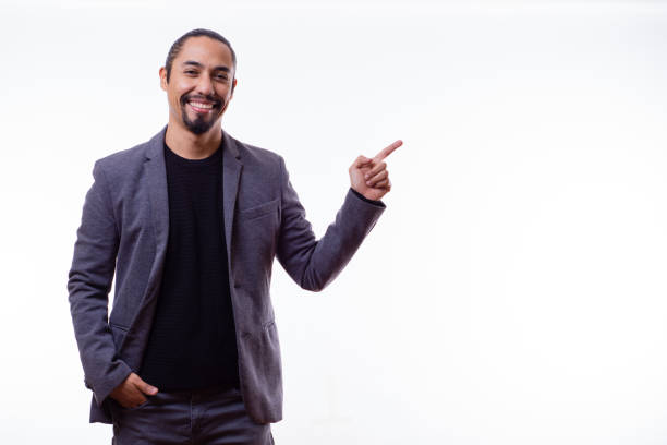 istock businessman pointing to the white space. 1745279223