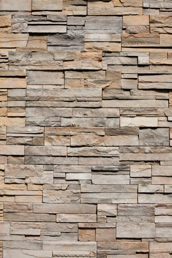 Stacked stones in a wall as architectural or accent feature.  