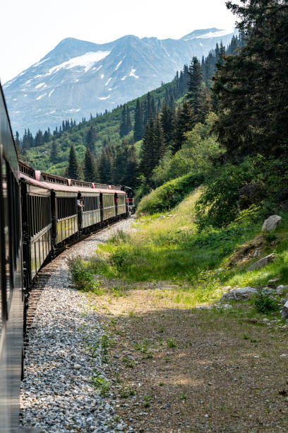 istock White Pass Summit excursion tour train in the mountains, Alaska, USA. 1745305138