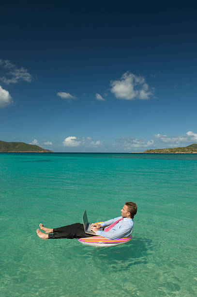 istock Businessman Floating Some Ideas Working Tropical Sea 174531388