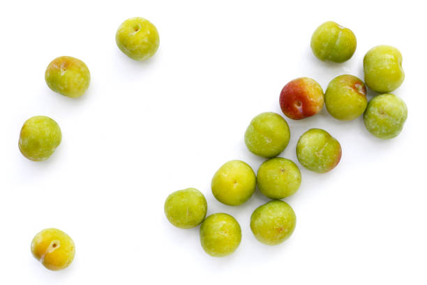 Fresh green plum on white background