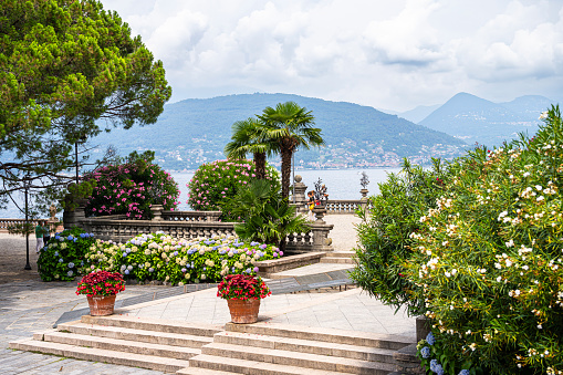 Isola Bella garden at the tip of the island (Borromean Islands), in Lake Maggiore, in Northern Italy (great lakes region). The Borromean Islands are a group of islands that include Isola Bella, Isola dei Pescatori, and Isola Madre which can be visited. July 23, 2023