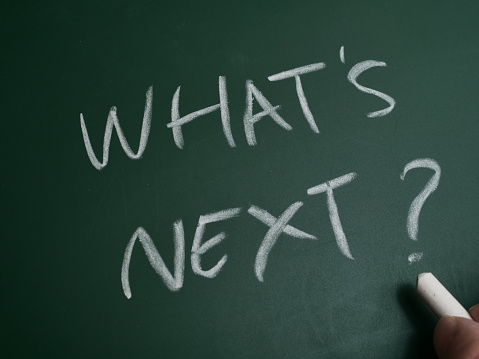 What next, text words typography written on chalkboard, life and business motivational inspirational concept