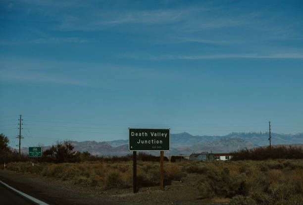 Driving through the vast wilderness of Death Valley. Empty roads in the beautiful nature.