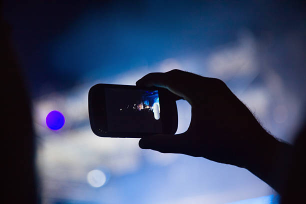 istock Photographing with cell phone at the concert 174537813