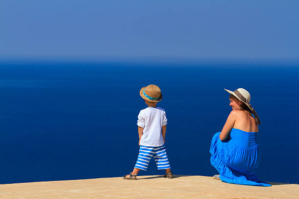 istock mother and son enjoying sea vacation 174538017