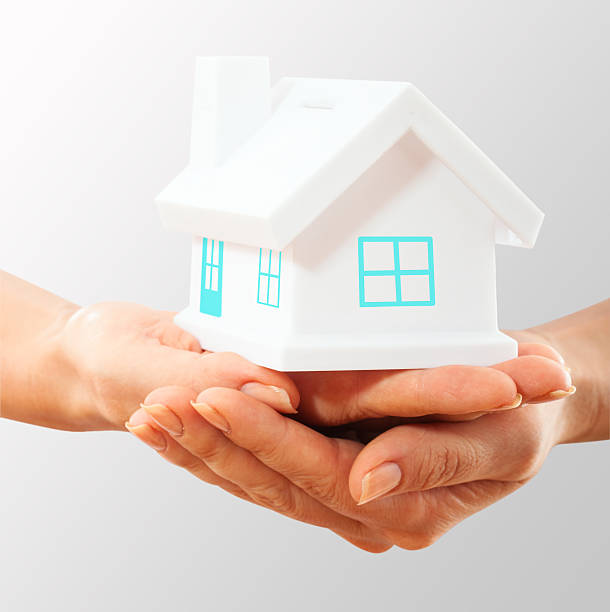 istock The house in human hands 174542477