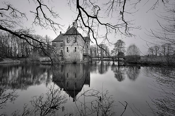 Bojnice, Slovakia - December 23, 2015: Famous Bojnice Castle in Bojnice, Slovakia with reflection in pond at clear autumn day.