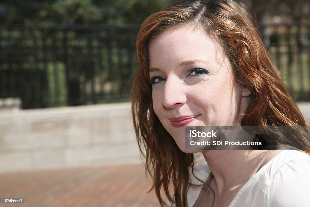 Smiling Red Head College Student Smiling Red Head College Student. Plenty of copy space available. Closed Stock Photo