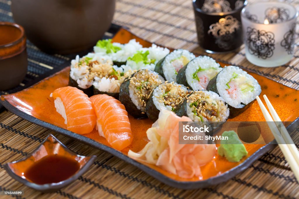 A sushi set with wasabi, soy sauce and chop stick Sushi set with salmon nigiri and big maki Avocado Stock Photo