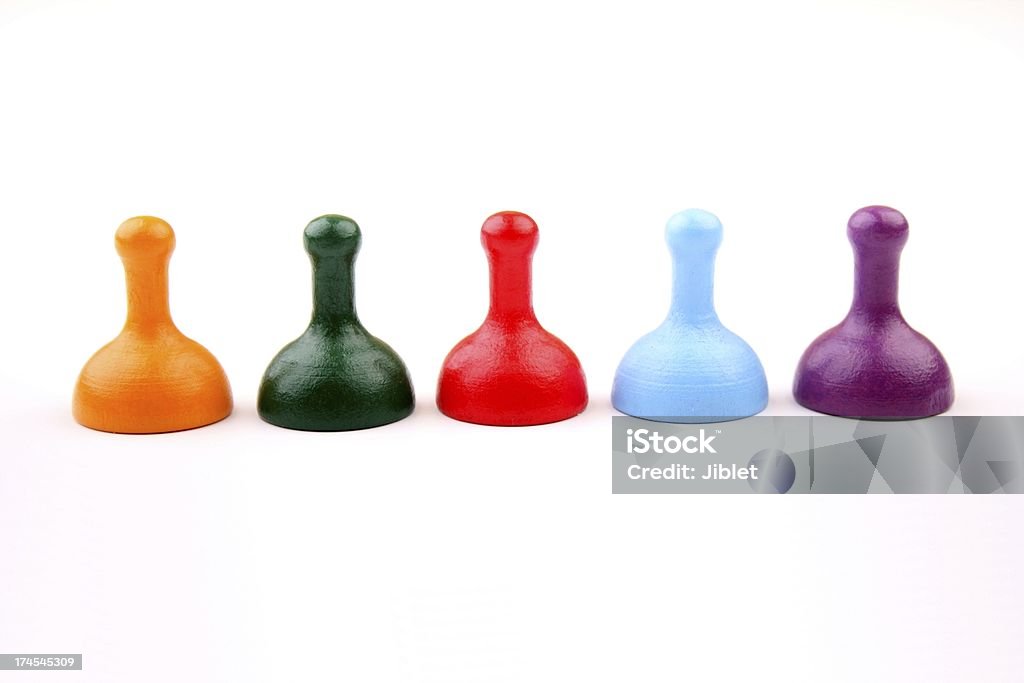 Select your player A line up of multi coloured playing pieces used in many generic board games. Board Game Stock Photo