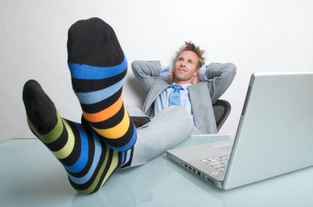 istock Businessman Office Worker Relaxing with Feet Up at Laptop 174545312