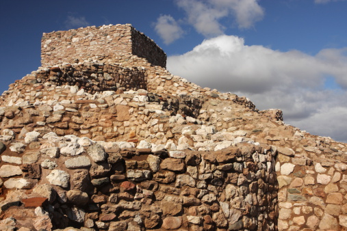 Tuzigoot National Monument ruin under dramatic sky an 1100 to 1400 AD Sinaguan adobe pueblo ruin.