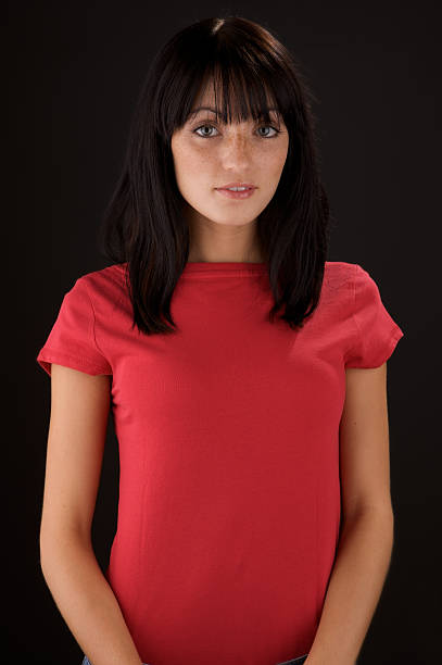 istock Young woman with blank red shirt 174546563