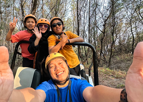 Family Selfie Portrait Enjoying Offroad  at The Forest