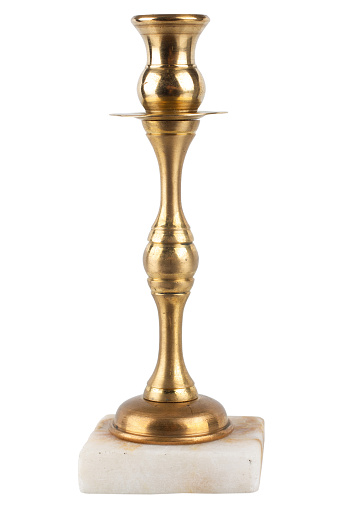 A three headed antique 19th century bronze candlestick on white background.