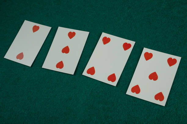 istock Old west era playing card on gambling table. 2,3,4,5 of hearts. 1745534261