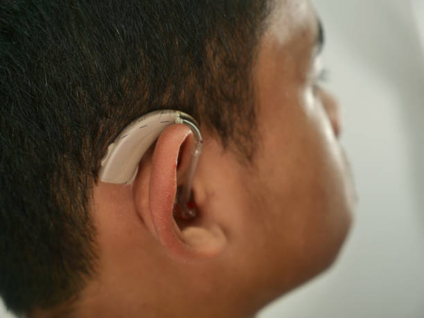 istock Portrait of Asian boy wearing hearing aid device 1745603768