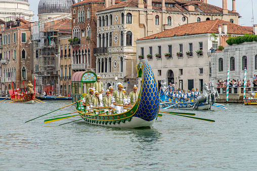 Venice, Italy - October 12th 2022: Parked gondola in Canal Grande with a sign saying Gondola Service