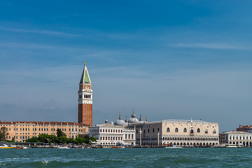 View of Doge´s Palace, Campanile and coastline from the Grand Canal at Venice, Italy. \nThe city of Venice is an Unesco World Heritage site and it is visited daily by thousands of tourists from all over the world.