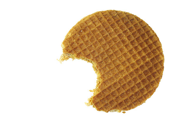 stroopwafel with a bite missing - stroopwafel stockfoto's en -beelden