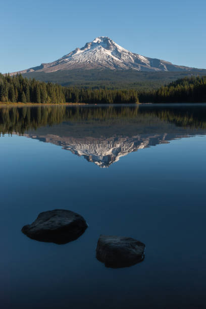istock Mountain reflecting over calm lake water 1745614411