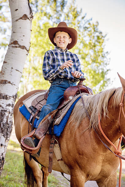 istock Horseback Riding Young Cowboy 174565660