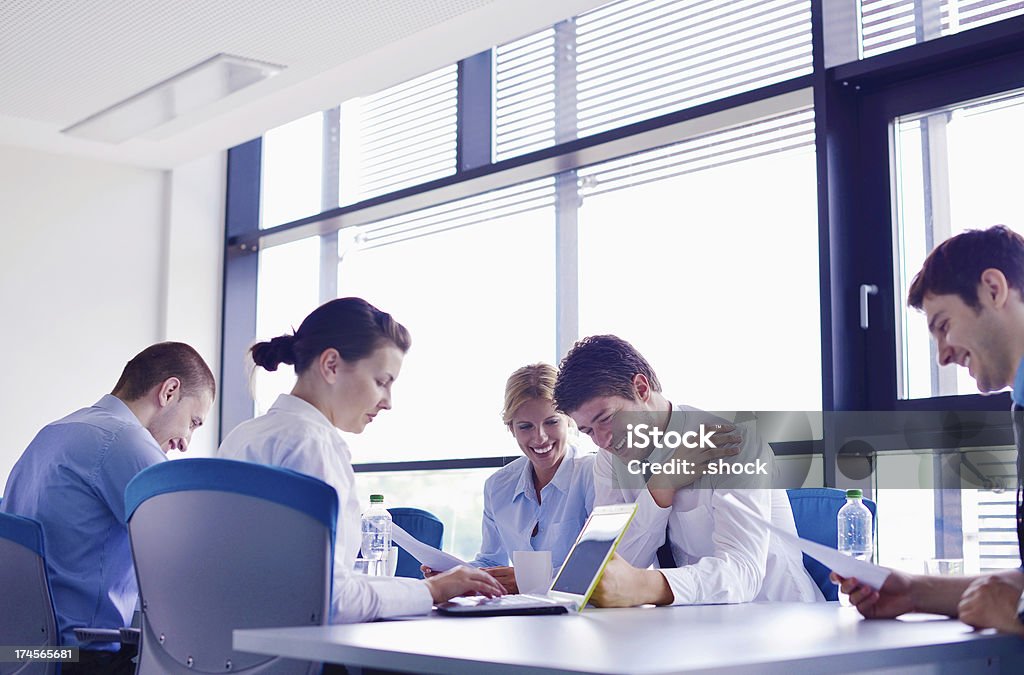 business people group  in a meeting at office Group of happy young  business people in a meeting at office Adult Stock Photo