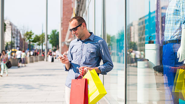 istock Man shopping with many colored bags in his hand. 174568926