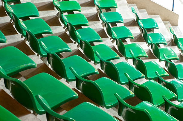 istock Plenty of green plastic seats at stadium . 174569168