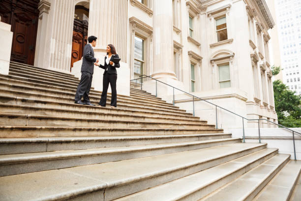 istock Professionals in Discussion on Staircase 174569615