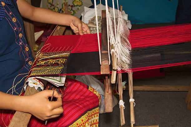 istock Women weaving a cloth  in Chiang Mai 174571696