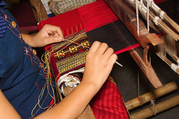istock Women weaving a cloth  in Chiang Mai 174571759
