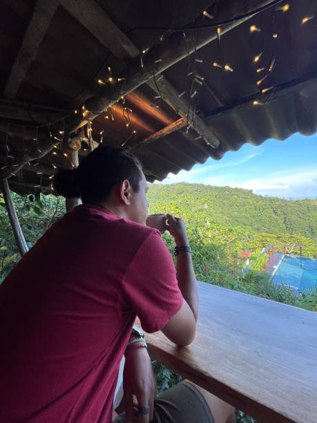 istock Man drinking coffee with the mountains in the background 1745726713