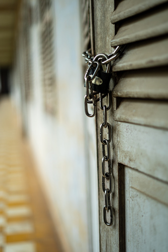 A compelling stock image capturing the atmosphere of a rustic hall with a weathered and aged door, adorned with a sturdy chain and lock. The photograph evokes a sense of security, history, and the enduring charm of an aged setting.

In this image, the chain and lock serve as a visual anchor, showcasing the hall's character and the elements of protection and closure. The weathered surroundings add to the rustic ambiance, inviting contemplation and a sense of historical significance.

This photograph is a versatile asset for various creative projects that aim to convey the rustic and secure ambiance of a location, whether it be in the context of vintage decor or the preservation of historical elements in a contemporary setting.