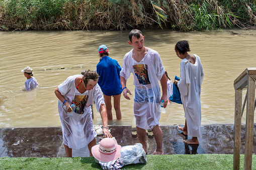 Jericho, Israel - November 1, 2016: Group of Pilgrims at the Baptism Site called Qasr el Yahud. Its located at Jordan River in the Region of the West Bank in Israel