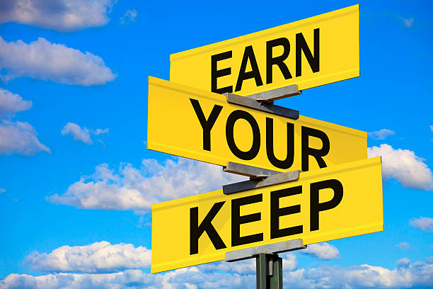 istock Earn Your Keep Street Sign 174573984