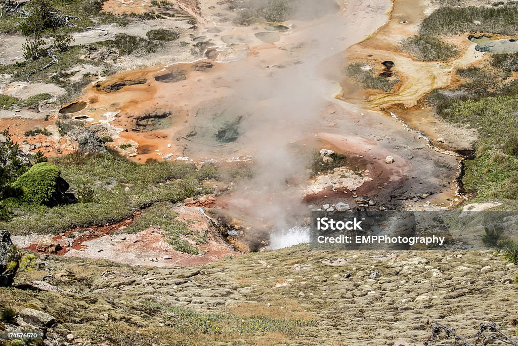 Steam from Hot Springs at Artists Paintpots Yellowstone National Park Steam raising from one of the hot springs at Artists Paintpots in Yellowstone National Park Beauty In Nature Stock Photo