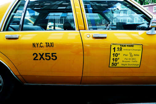 Retro Yellow Cab photographed on the streets of Manhattan, New York City 2013.