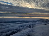 In between beautiful layers of cloud while departing from san francisco airport in sunset