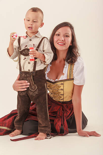 Reichersdorf, Germany - October 11, 2009: Women in traditional Bavarian festive costumes sitting next to each other in a carriage during St. Leonhard pilgrimage