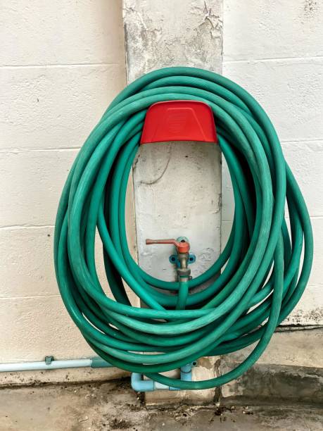 istock a green garden hose with a red lid. 1745816243
