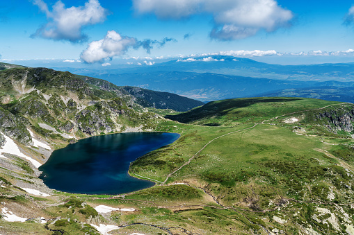 A breathtaking view of the Seven Rila Lakes, nestled in the heart of the Rila Mountains in Bulgaria, showcasing pristine turquoise waters and rugged mountains.