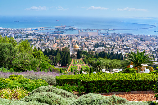 Haifa, Israel - August 16, 2023: Shrine of the Bab, Bahai Gardens with surrounding landscape and cityscape, Haifa, Israel.