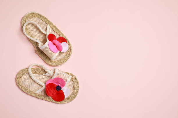 istock Cute baby shoes on beige background, flat lay. Space for text 1745831290
