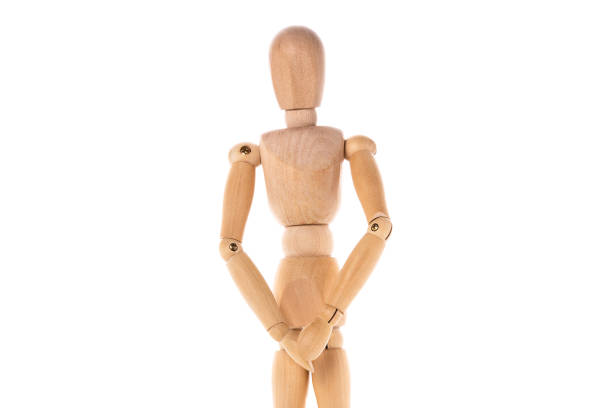 istock A wooden mannequin standing in front of a white background. This versatile image can be used for various purposes. 1745849535